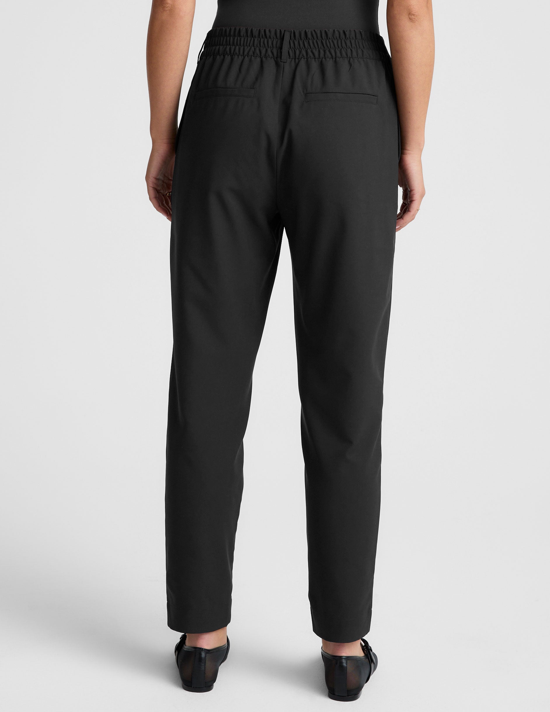 Beyond Yoga Women's Tapered Mid Rise Jetstretch Pants - Black